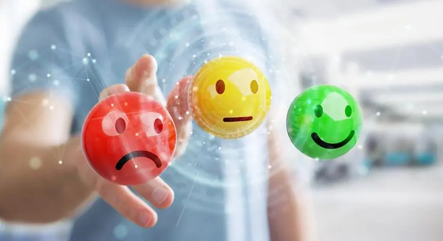 Close-up of three dice with icons for phone, chat, and email, representing communication strategies to enhance local SEO efforts.