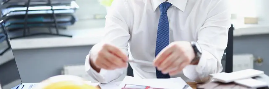 Man at desk without head